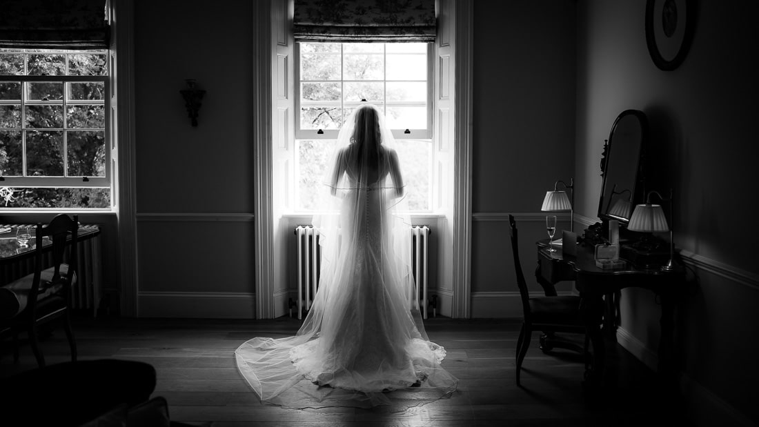bride looking out window at clonwilliam house