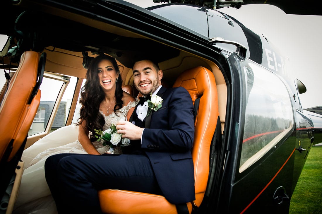 bride and groom in a helicopter
