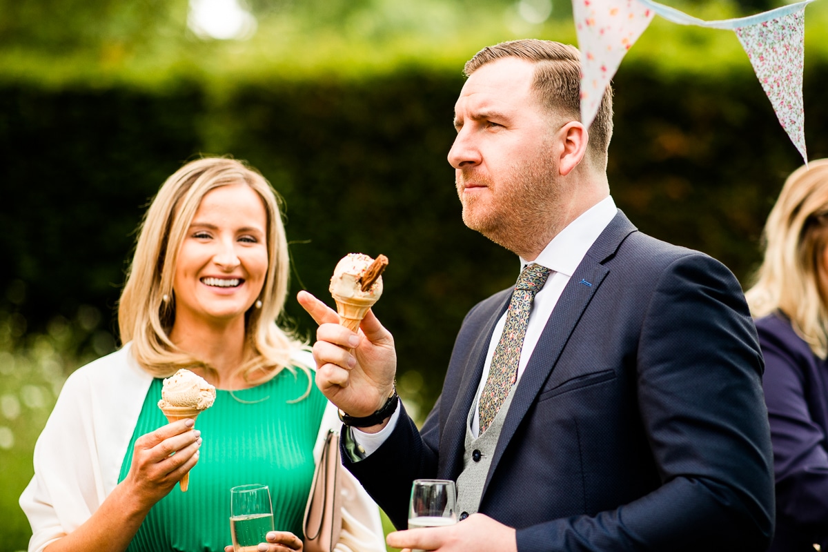 wedding guest eat ice cream in the gardens At Ballintubbert Gardens and House