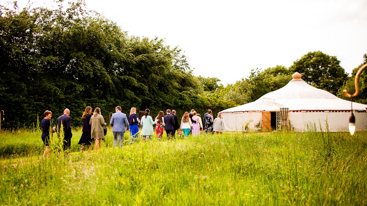 the wedding guest walk to the marquee Wedding At Ballintubbert Gardens and House