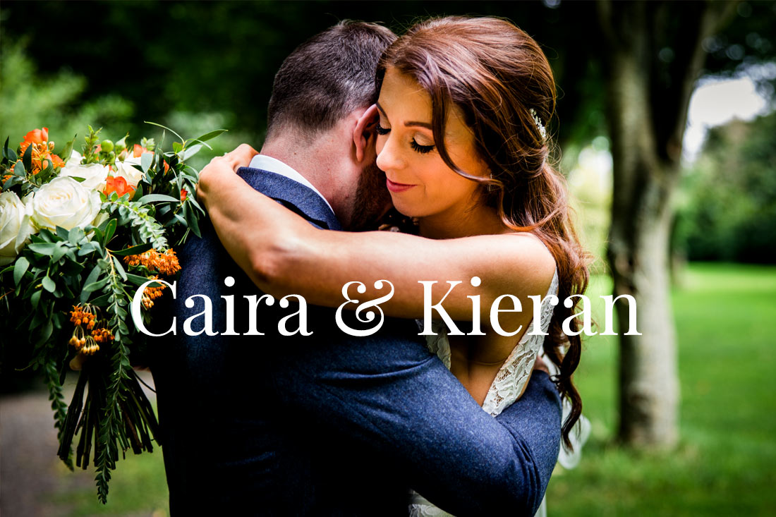Ciara & Kieran hug in the grounds of barberstown castle