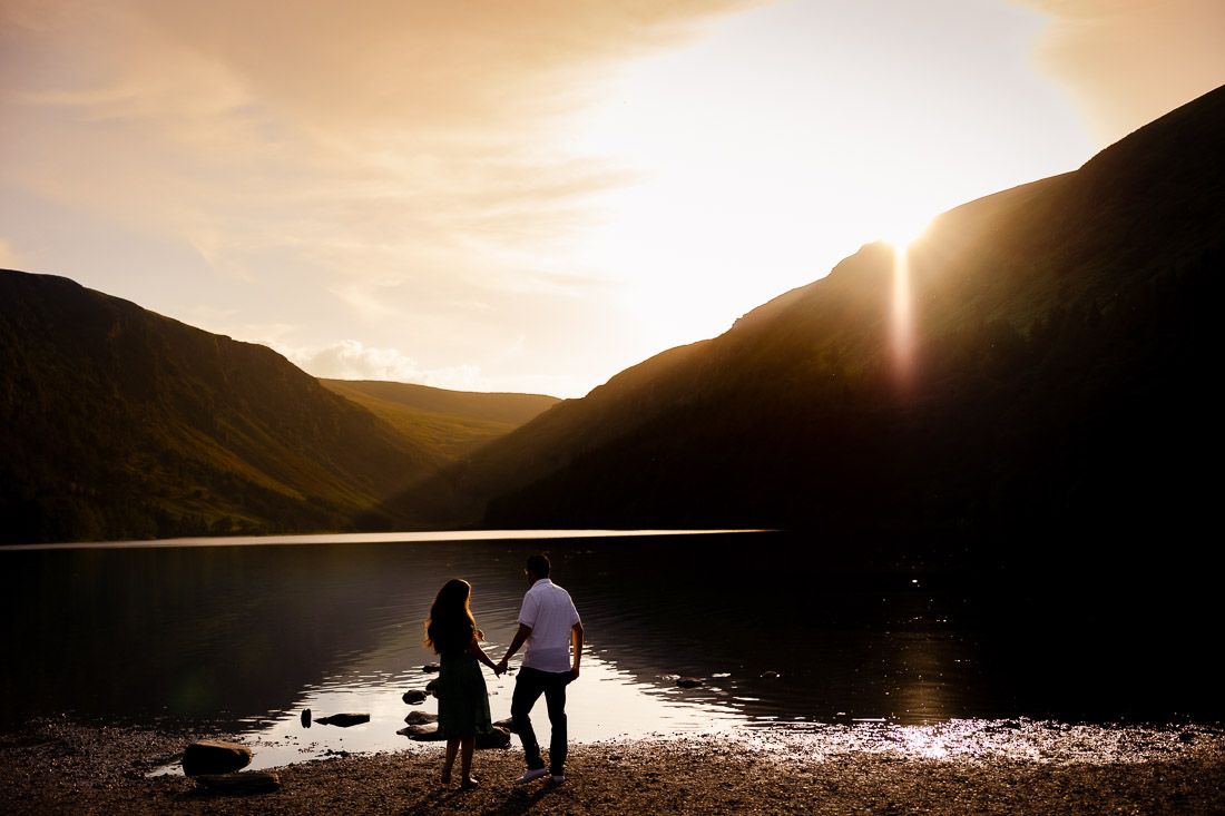engaged couple get very romantic at sunset