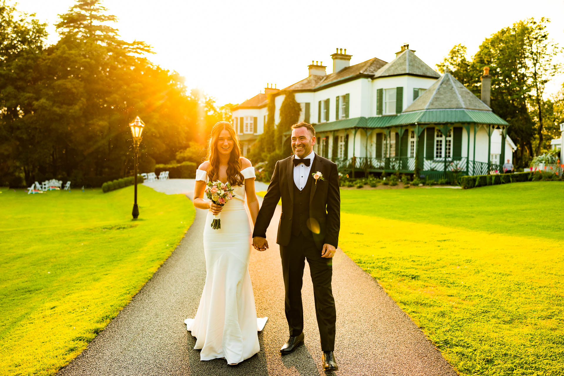 sunset image of a bride and groom in Ashley park house
