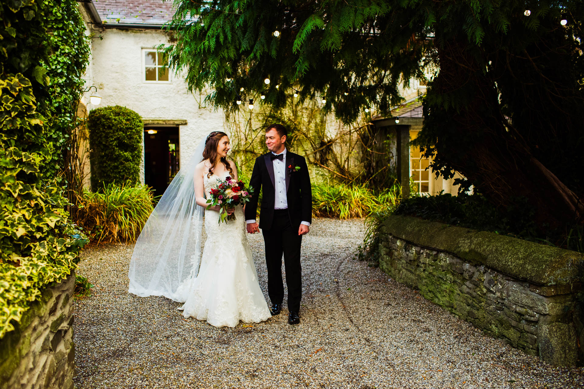 bride and groom walking in rathsallagh country house gardens
