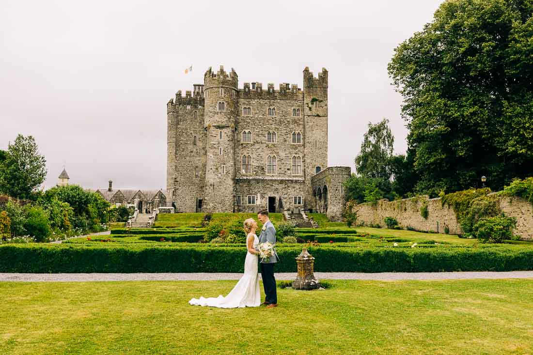 Couple in kilkea castle grounds with castle in background