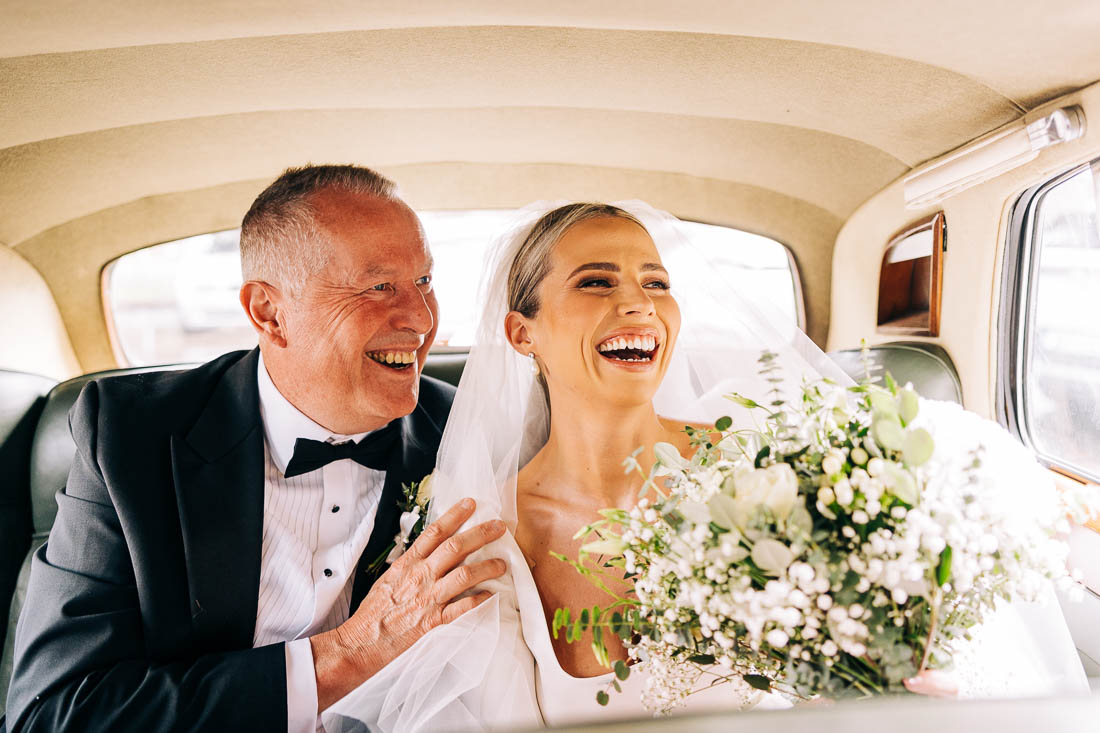 bride and her father in the wedding car