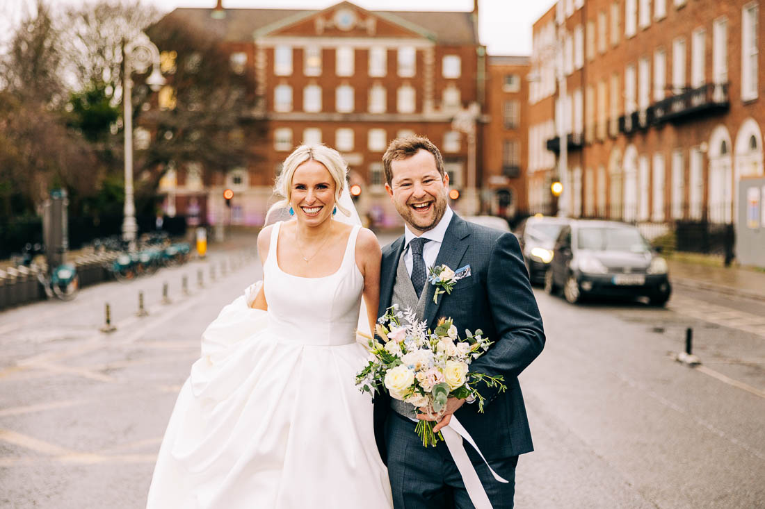 Bride and groom walk in dublin city