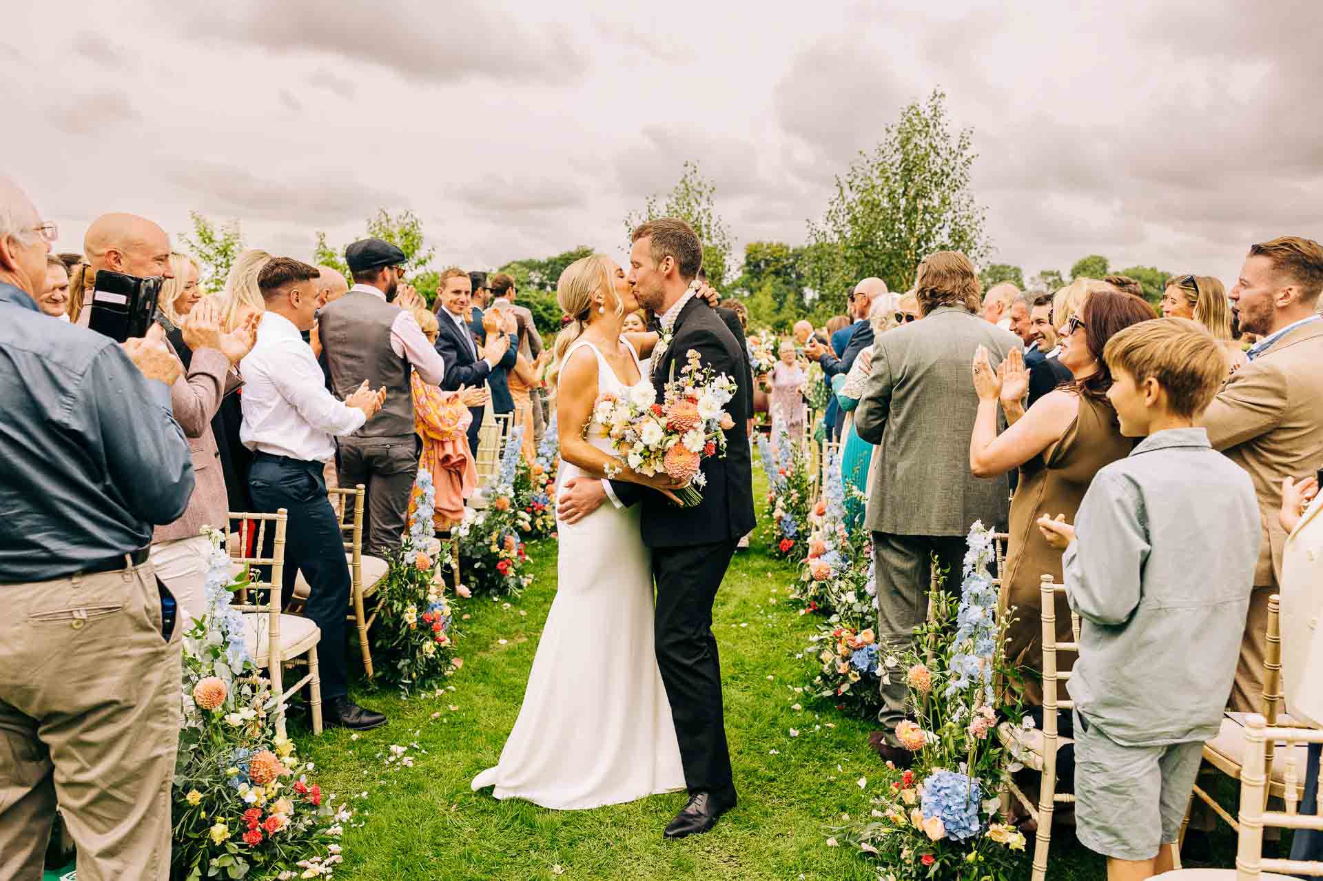 Bride anf grooms first kiss at their home wedding