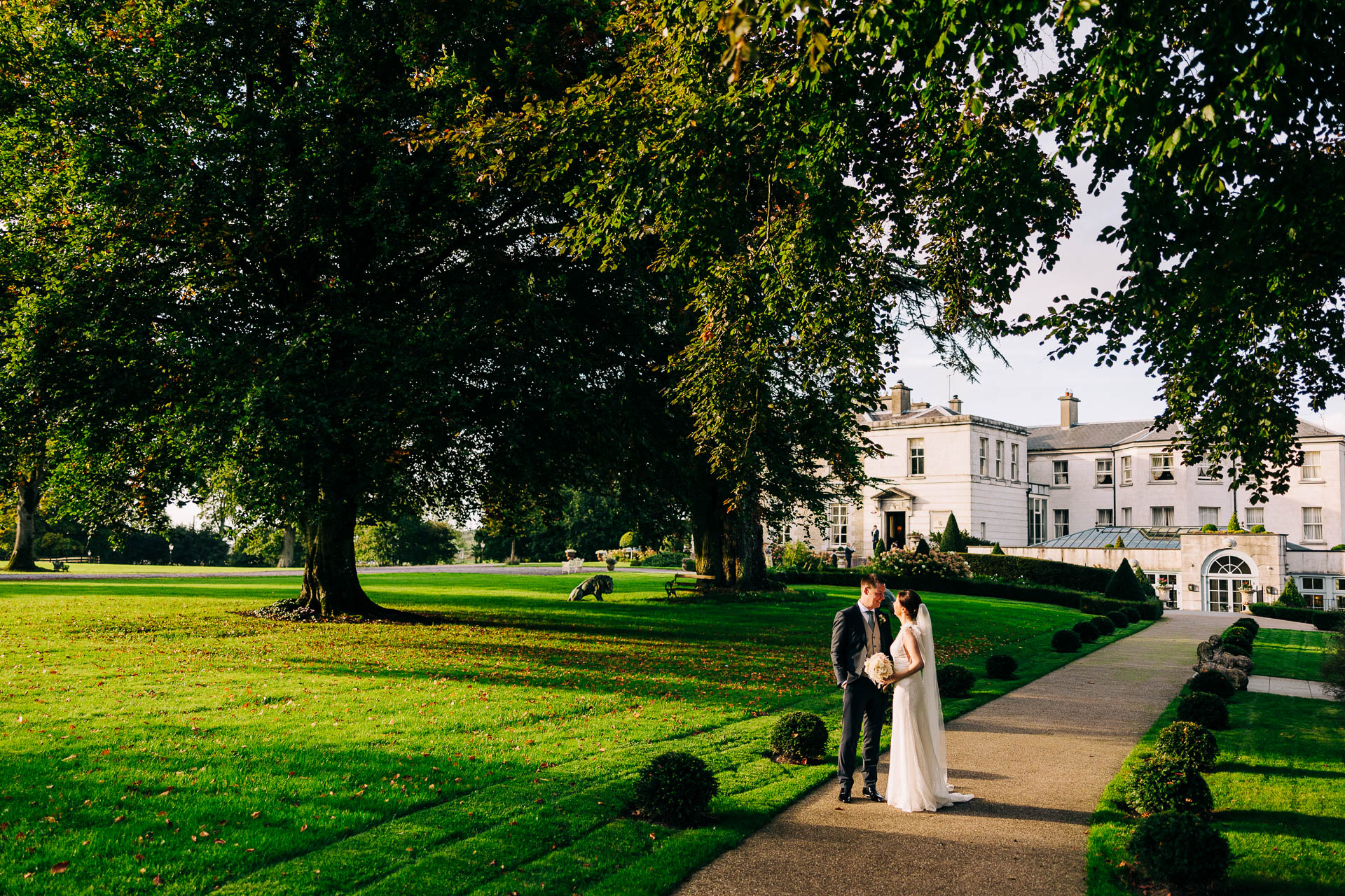 Newly married couple at the front of tankardstown house
