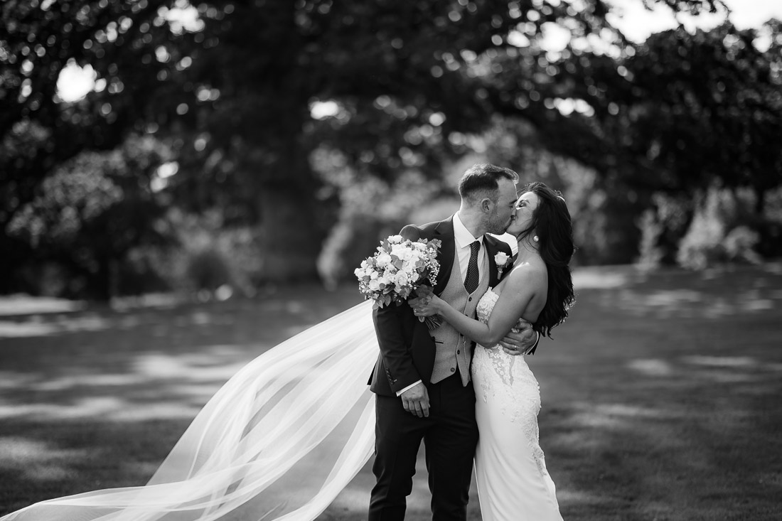 Couple exchange a kiss at rathsallagh house