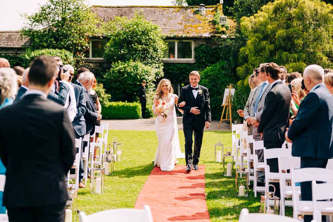 Dad walking daughter to meet her groom in Rathsallagh House gardens