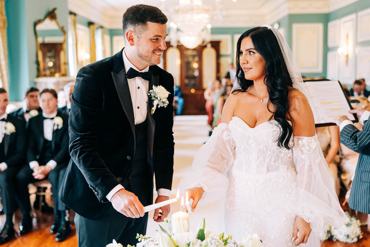 Bride and groom Light a candle in the Belling Suite